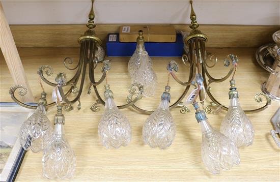 A pair of gilt brass three-light wall lights,